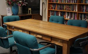 conference table, chair, and background view of bookshelf