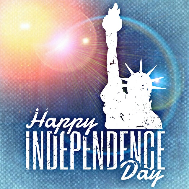 sun-flared background with Statue of Liberty bust outline with "Happy Independence Day"