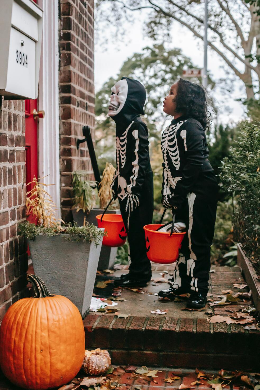 stock image of children going trick or treating