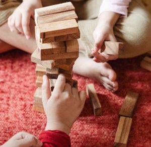 stock image of children playing jenga