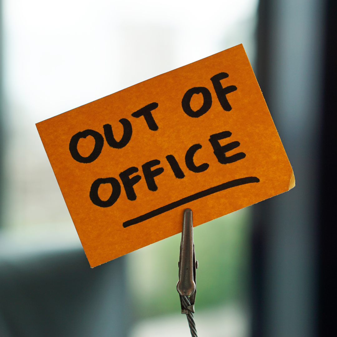 picture of sticky note that says "out of office"